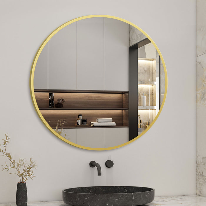 golden framed round mirror